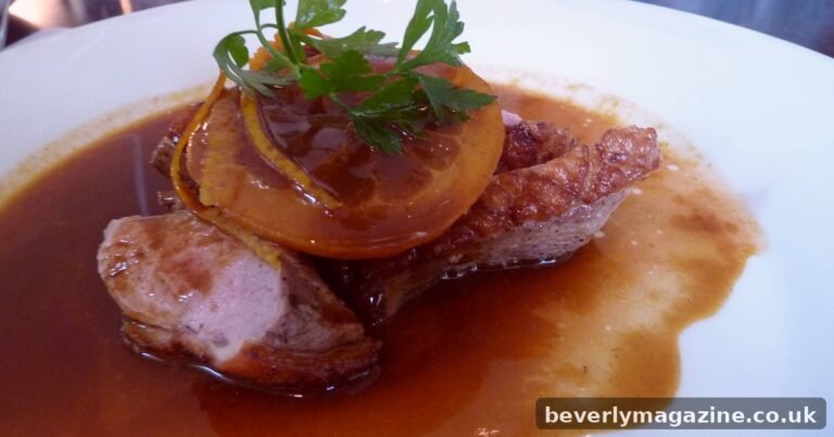 Roast duck breast with glossy orange sauce and caramelized orange slices