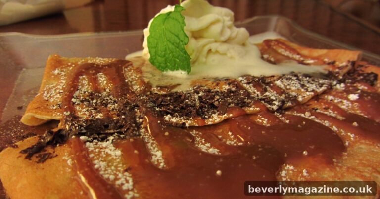 Dulce de leche crepe topped with caramel sauce, chocolate shavings and whipped cream