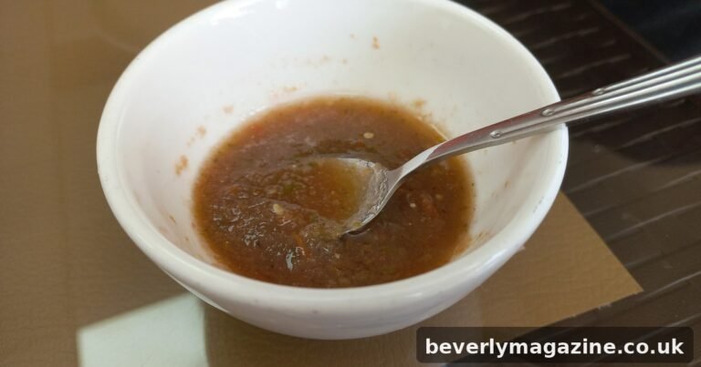 Small bowl of red llajwa salsa with tomatoes and peppers